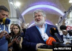 FILE - Ukrainian business tycoon and owner of one of Ukraine's largest media conglomerates, Igor Kolomoisky, speaks with journalists in Kyiv, Ukraine Sept. 13, 2019.