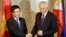 FILE - Philippine Foreign Affairs Secretary Albert Del Rosario, right, welcomes Vietnamese Foreign Minister Pham Binh Minh for their 7th Meeting of the Philippines-Vietnam Joint Commission for Bilateral Cooperation (JCBC) in Manila, Philippines, Aug. 1, 2013 .