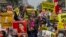 FILE - Demonstrators protest against Myanmar's military junta in Mandalay, Myanmar, Feb. 18, 2021.