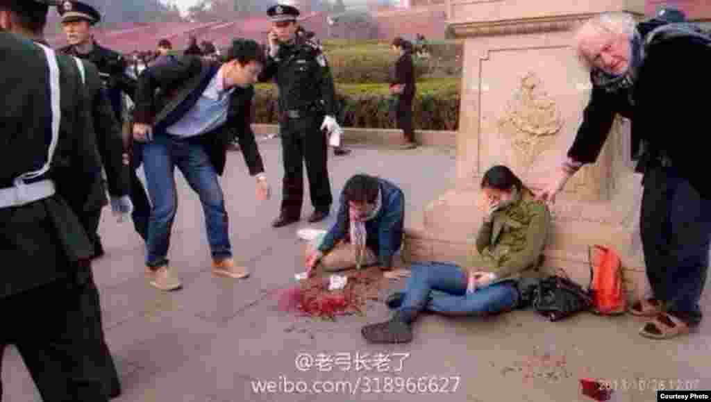 Wounded people are seen after a car accident at Tiananmen Square in Beijing, Oct. 28, 2013. (Image taken from weibo)