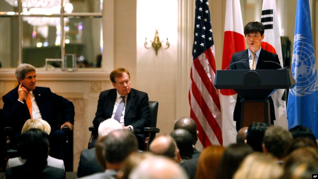 Secretary of State John Kerry, left, and State Department special envoy Robert King, center, listen as North Korean human rights activist Shin Dong-hyuk delivers remarks during an event on human rights in North Korea at the Waldorf Astoria Hotel Tuesday, 