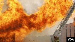Firefighters at site of Jim Beam whiskey warehouse fire, Bardstown, Kentucky.
