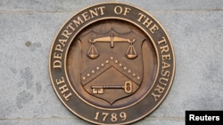 FILE PHOTO: Signage is seen at the United States Department of the Treasury headquarters in Washington, D.C.