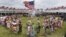 Native American dancers from more than 20 reservations in North and South Dakota perform before the arrival of President Barack Obama and first lady Michelle Obama on the Standing Rock Indian Reservation Friday, June 13, 2014, in Cannon Ball, N.D.