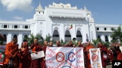 Myanmar Buddhist monks display anti-OIC banners during a rally in Yangon