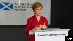 FILE - A handout picture released by the Scottish Government shows Scotland's First Minister Nicola Sturgeon speaking during the Scottish government's daily briefing on the COVID-19 outbreak, in Edinburgh, April 6, 2020.
