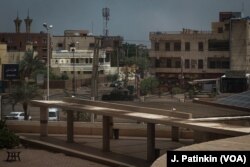 A military vehicle drives past the gates of Royal Care Hospital, in Khartoum, Sudan, June 4, 2019.