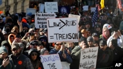 Gun-rights supporters demonstrate in front of the state Capitol in Richmond, Va., Jan. 20, 2020. 