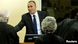 Kosovo's former Prime Minister and former commander of the Kosovo Liberation Army Ramush Haradinaj smiles during the verdict reading in his retrial at the International Criminal Tribunal for the former Yugoslavia in The Hague November 29, 2012.