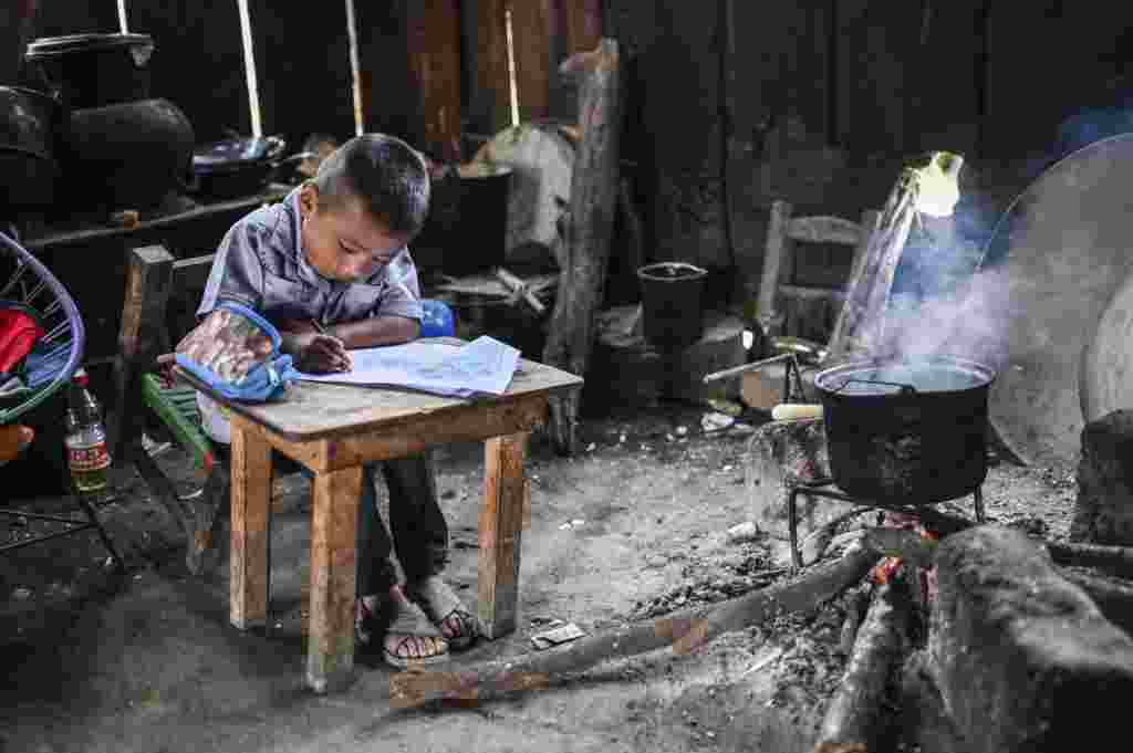 A boy the Santiago family is homeschooled in San Miguel Amoltepec Viejo, Guerrero state, Mexico, amid the COVID-19 pandemic.