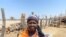 Felistus Gwatipedza sells milk produced on her farm to a Zimbabwe Stock Exchange-listed company and is able to look after her orphaned grandchildren, in Rusununguko village, some 200 kilometers south of Harare, Sept. 25, 2020. (Columbus Mavhunga/VOA)