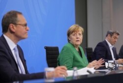 German Chancellor Angela Merkel attends a news conference after a meeting with state leaders to discuss options beyond the end of the pandemic lockdown, amid the outbreak of the coronavirus disease (COVID-19), in Berlin, Germany, March 23, 2021.