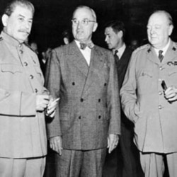 President Harry Truman, center, talks with Soviet leader Josef Stalin, left, and British Prime Minister Winston Churchill, at the Potsdam Conference near Berlin, on July 17,1945