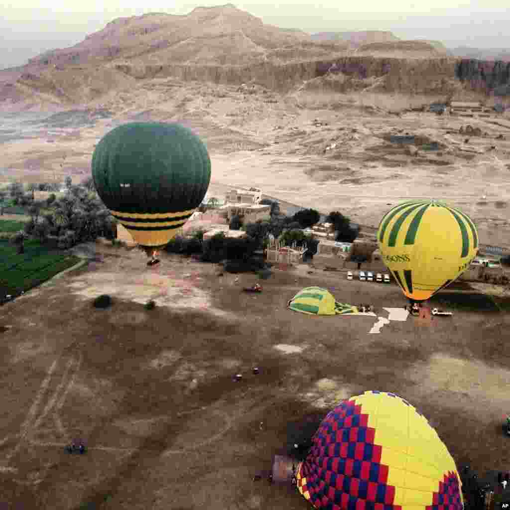 In this image made available by Christopher Michel, the launch site near Luxor in Egypt, shortly before a hot air balloon explosion, February 26, 2013. 