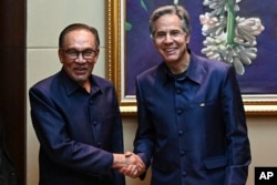 Malaysian Prime Minister Anwar Ibrahim meets with U.S. Secretary of State Antony Blinken during the Association of Southeast Asian Nations Summit in Vientiane, Laos, on Oct. 10, 2024.