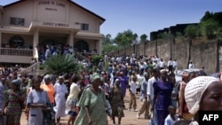 FILE - Several hundred Sierra Leoneans leave a church in Freetown.