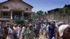 FILE - Several hundred Sierra Leoneans leave a church in Freetown.