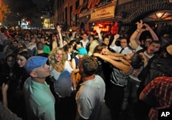 FILE - People celebrate in front of the Stonewall Inn, right, after the passing of the state's same-sex marriage bill in New York, June 24, 2011.