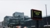 Cars pass the Jacob K. Javitz Convention Center, April 3, 2020, in New York. 