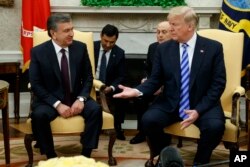 President Donald Trump meets Uzbek President Shavkat Mirziyoyev in the Oval Office of the White House, Wednesday, May 16, 2018, in Washington. (AP Photo/Evan Vucci)