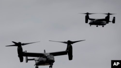 FILE - US Marine Corps V-22 Osprey aircraft approach for landing in New York, Sept. 25, 2014.