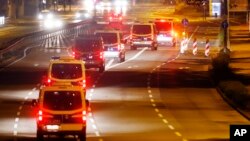 Police cars drive on an almost deserted street during an evacuation of more than 60 000 people in Frankfurt, Germany, Sept. 3, 2017. The evacuation became necessary because of an unexploded 1.8 ton WW II bomb that will be diffused later in the day. 