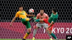 FILE — A picture showing South African goalkeeper Ronwen Williams in posts while his defender Luke Fleurs fights for the ball against Mexico's Henry Martin, during a match at the 2020 Summer Olympics, on July 28, 2021, in Sapporo, Japan.