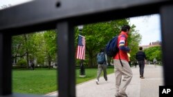 FILE - Students walk at Main Quadrangle on the University of Chicago campus, Monday, May 6, 2024, in Chicago. 