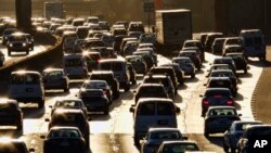 FILE - Morning rush hour traffic makes its way along US 101 near downtown Los Angeles, California, Nov. 15, 2016.