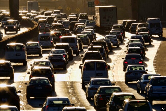 FILE - Morning rush hour traffic makes its way along US 101 near downtown Los Angeles, California, Nov. 15, 2016.