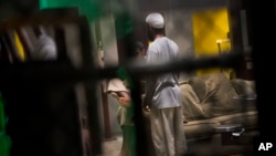 This June 6, 2018 photo, reviewed by US military officials, shows detainees inside the Camp 6 detention facility at Guantanamo Bay U.S. Naval Base, Cuba. (AP Photo/Ramon Espinosa)