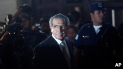 FILE - Guatemala's former dictator Efrain Rios Montt is seen returning from a break in court in Guatemala City, Jan. 26, 2012.