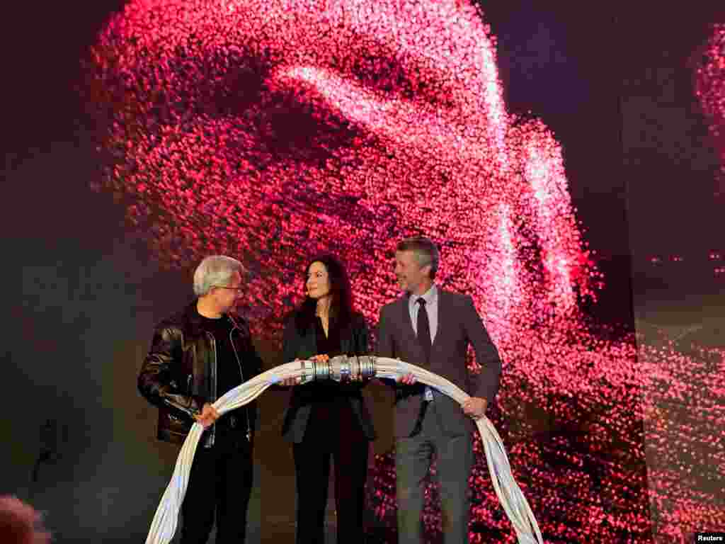 Nvidia CEO Jensen Huang, CEO of Danish Center for AI Innovation Nadia Carlsten, and Denmark&#39;s King Frederik be  the motorboat  of a supercomputer successful  Copenhagen, Denmark.