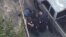 This aerial image made from a helicopter video provided by WHDH shows several officers allegedly pummeling Richard Simone, who had exited his vehicle after a high-speed police pursuit, in Nashua, New Hampshire, May 11, 2016.