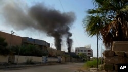 Smoke rises after bombing targets Islamic State positions in Fallujah, Iraq, May 24, 2016. The humanitarian situation in the city is reportedly desperate, with no safe routes for civilians to escape.