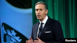 FILE - Starbucks Chairman and CEO Howard Schultz delivers remarks at the Starbucks 2016 Investor Day in New York, Dec. 7, 2016.