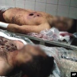 The bodies of young men the government says are soldiers killed near Damascus, January 2012.