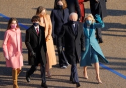 U.S. President Joe Biden, his wife, Jill, and members of their family walk to the White House during the Inauguration Day parade, in Washington, Jan. 20, 2021.