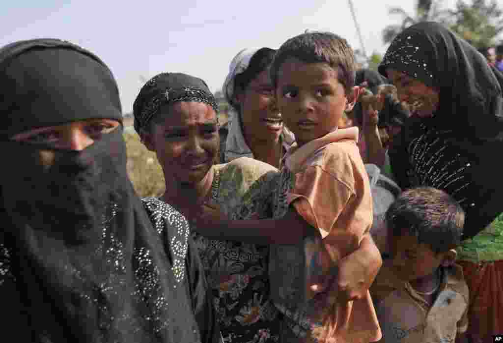 Rescued migrants weep upon arrival in Simpang Tiga, Aceh province, Indonesia, May 20, 2015.