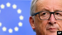 European Commission President Jean-Claude Juncker listens to questions during a media conference at the conclusion of an EU summit in Brussels, Oct. 20, 2017. 