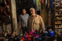 Yousuf Hamul, a 60-year-old cobbler says Syrian people are tired of fighting, but he feels it is not safe to suggest that he supports any side, Aug. 30, 2019 in Manbij, Syria. (VOA/Yan Boechat)