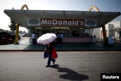 Customers visit a historic McDonald's restaurant in Downey, California, February 18, 2015.