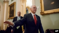 FILE - Vice President Mike Pence arrives on Capitol Hill in Washington for a Senate Republican strategy session, March 14, 2017.