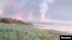 Smoke and flames rise following a Ukrainian drone attack, amid the Russia-Ukraine conflict, in Toropets, Tver region, Russia Sept.18, 2024, in this screen grab obtained from a social media video. 