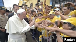 Pope Francis arrives to visit the College Carlos and Marcelo in Trujillo, Peru, Jan. 20, 2018.