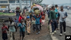 People displaced by the fighting with M23 rebels make their way to the center of Goma, Democratic Republic of the Congo, Jan. 26, 2025.