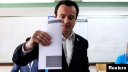 FILE - Albin Kurti, leader of the Vetevendosje (Self-determination) political party, casts his vote at a polling station in the capital city Pristina, June 8, 2014.