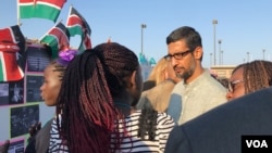 Google CEO Sundar Pichai speaks with teams of girl coders Thursday at Google's campus in Mountain View, Calififornia, August 10, 2017, as part of an international girl coding competition. (M. Quinn/VOA)