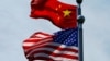 FILE - A Chinese and U.S. flag flutter near The Bund, before U.S. trade representatives meet with their Chinese counterparts for talks in Shanghai, China, July 30, 2019.