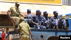 FILE - Ugandan policemen are seen on a truck.